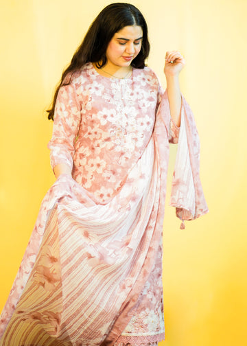 Woman wearing a floral dress against a yellow background