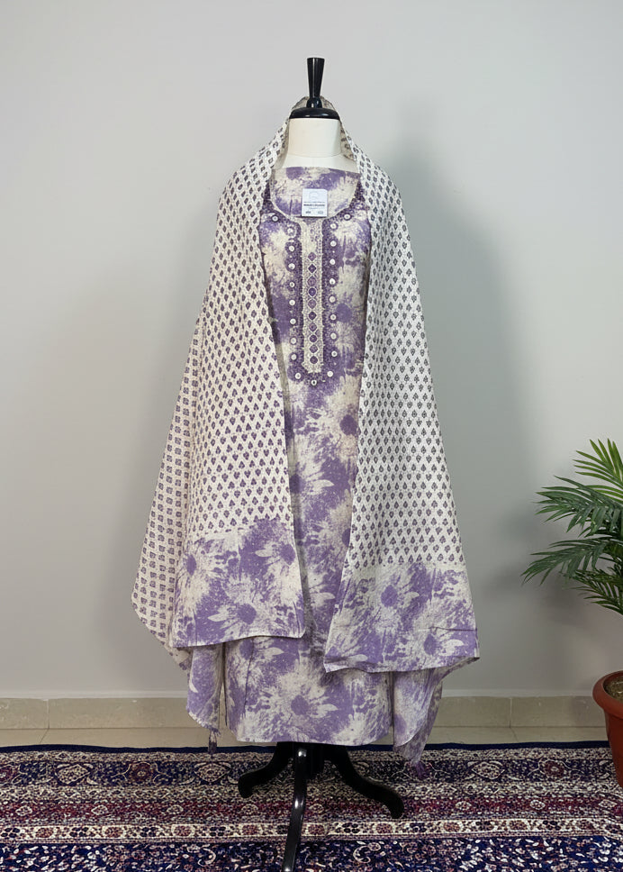 Mannequin wearing a floral dress with a white background