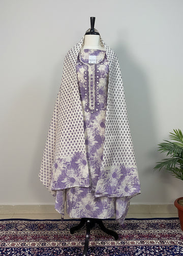 Mannequin wearing a floral dress with a white background