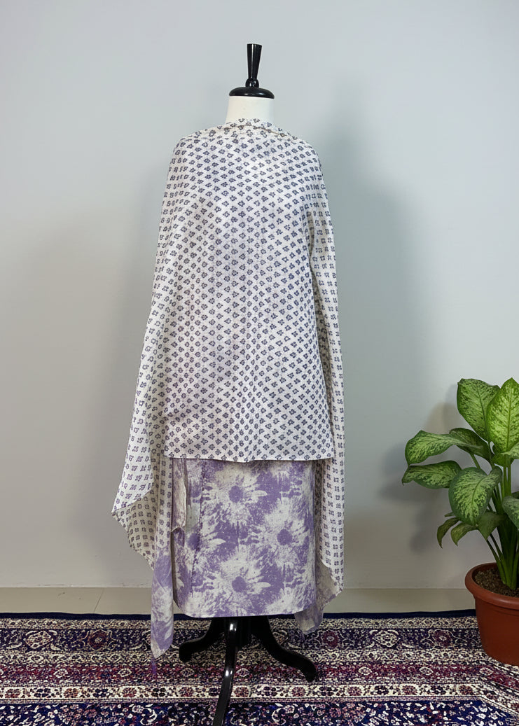 Mannequin wearing a patterned dress with a plain background