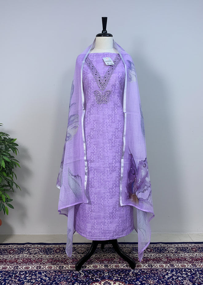 Lavender dress with matching scarf on a mannequin against a beige curtain background.