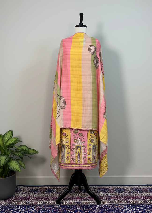 Colorful traditional garment on a mannequin against a plain background