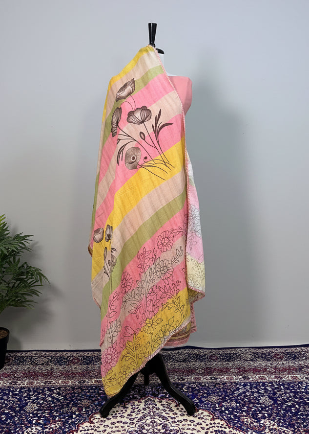 Colorful patterned fabric draped over a mannequin against a plain background